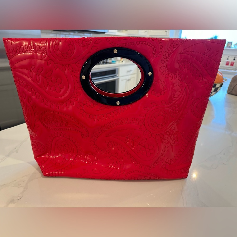 Trendy Kate Spade clutch/handle bag. Adds a perfect pop of color to any outfit.